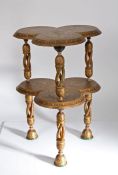 Anglo-Indian Kashmir Papier Mache side table, the shaped top with gilt ground and floral sprays