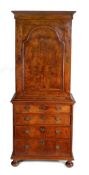 Queen Anne walnut cabinet on chest, the concave cornice above an arched panel door enclosing three