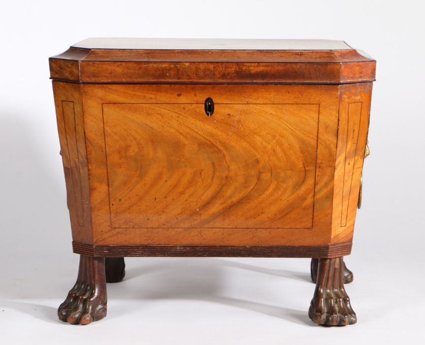 A good George III mahogany cellarette/wine cooler, the sarcophagus shaped body with a hinged lid