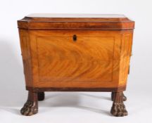 A good George III mahogany cellarette/wine cooler, the sarcophagus shaped body with a hinged lid