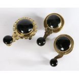 Three Victorian internal brass and black ceramic Victorian servants’ bell pulls / cranks (3)