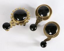 Three Victorian internal brass and black ceramic Victorian servants’ bell pulls / cranks (3)