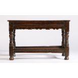 17th century table stool, the later top above a shaped frieze and solid frieze to the back above