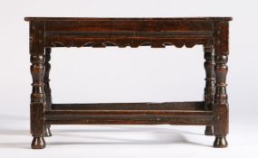 17th century table stool, the later top above a shaped frieze and solid frieze to the back above