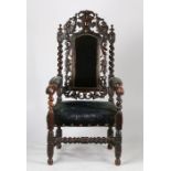 Substantial Victorian armchair, the pierced mythical creature and foliate carved cresting rail above