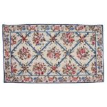 Decorative woolwork wall hanging, with an Aubusson style of flower sprigs and blue shaded borders,