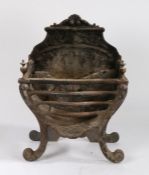 Regency style fire basket, the shell and scroll fire back with basket below and urn finials to the
