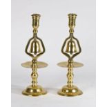 Pair of decorative 19th Century polished brass tavern candle holders with bells, in the 17th /