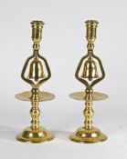 Pair of decorative 19th Century polished brass tavern candle holders with bells, in the 17th /