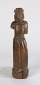 17th Century carved walnut figure, the standing figure with long robes and hat, 24.5cm high