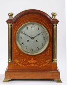 Late Victorian mahogany and marquetry inlaid mantel clock, the arched case with orb form brass