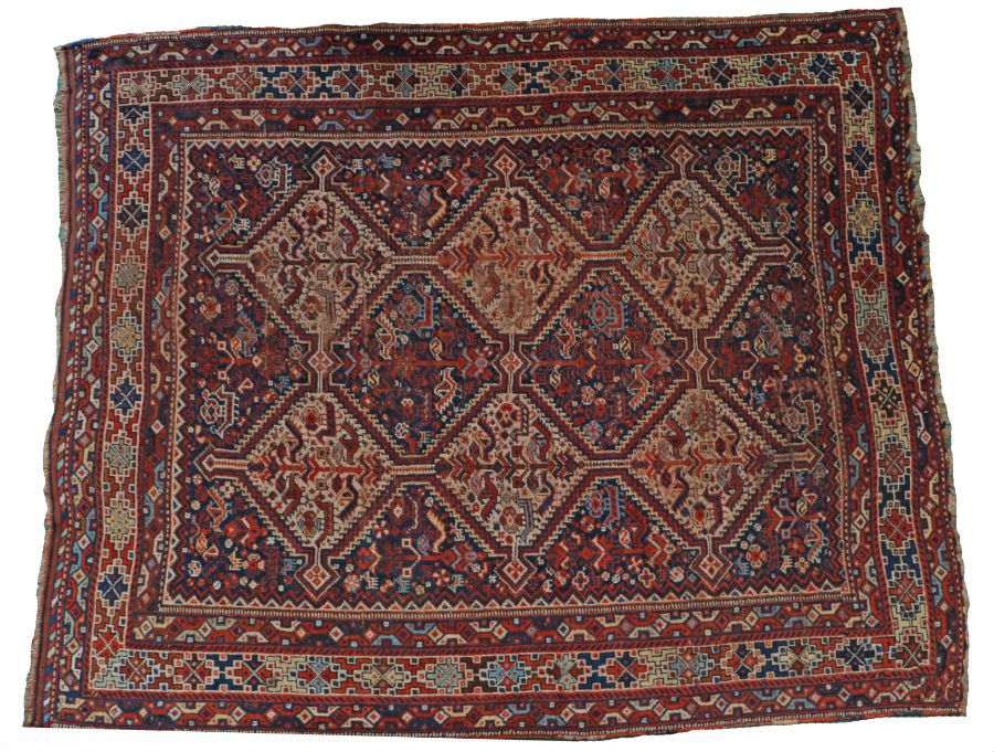 Persian rug, with twin rows of medallions and a border with geometric designs, 198cm long, 159cm