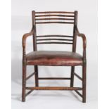 Regency mahogany armchair, the back carved to form bamboo style splats above a stuff over seat and