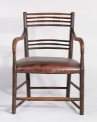 Regency mahogany armchair, the back carved to form bamboo style splats above a stuff over seat and