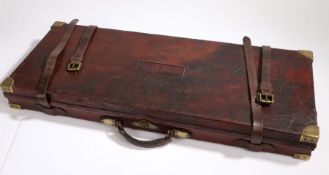 Holland & Holland double shotgun case, the brown leather case with brass corner mounts and central