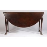 George III mahogany drop flap dining table, possibly Irish, the circular drop flap top above a