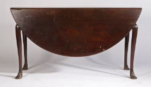 George III mahogany drop flap dining table, possibly Irish, the circular drop flap top above a