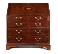 George III oak and inlaid bureau, the slopping fall with shell inlaid enclosing a series of