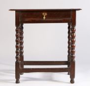 17th Century and later oak side table , the rectangular top above a frieze drawer and turned legs