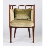 Edwardian mahogany tub chair, the curved open back raised on rectangular supports, with