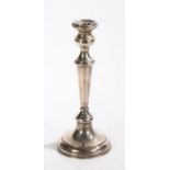 Silver candlestick, the waisted sconce above a tapering stem and loaded domed foot, stamped 925 to
