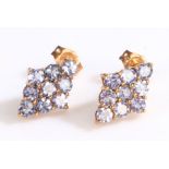 A pair of 10ct rose gold cluster earrings set with zircon. Measurements: 8.80 x 12.60mm. Stamped