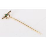 A 9 carat yellow gold insect pin.  Length 55mm. Weighing 0.80 grams.