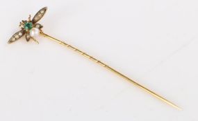 A 9 carat yellow gold insect pin.  Length 55mm. Weighing 0.80 grams.