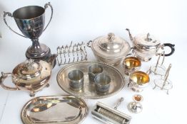 Silver plated ware to include trophy cup, tureen and cover, toast rack, condiment set, teapot