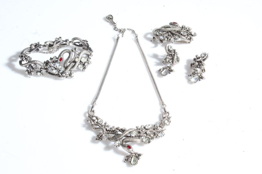 A set of jewellery by Jewelcraft with snakes and leaves, including a necklace, pair of earrings, a