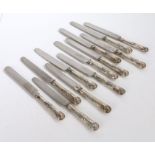 Set of twelve Victorian silver handled table knives, with kings pattern handles, the blades marked
