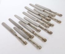 Set of twelve Victorian silver handled table knives, with kings pattern handles, the blades marked