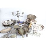 Silver plated ware, to include mussel shell form dish, rose bowl, candlestick, hair brushes etc. (