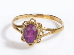 A 9 carat yellow gold ring set with one oval amethyst. Ring size O 1/2. Weighing 1.29 grams.