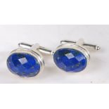 A pair of silver cuff-links set with Lapis Lazuli. Approx. measurements 15.50 x 12mm. Weighing 11