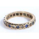 A 9 carat yellow gold ring set with blue and white cz. Ring size O 1/2. Weighing 3.3 grams.