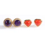 A pair of 9ct yellow gold heart shaped stud earrings set with coral.  Measurements: 9.5 x 9.8mm.