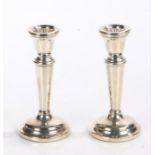 Pair of Elizabeth II squat silver candlesticks, Birmingham 1975, maker Sanders & Mackensie, the