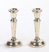 Pair of Elizabeth II squat silver candlesticks, Birmingham 1975, maker Sanders & Mackensie, the