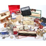 A large collection of costume jewellery with earrings, brooches, bangles, necklaces, hair