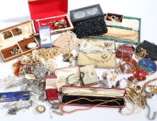 A large collection of costume jewellery with earrings, brooches, bangles, necklaces, hair