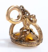 A 9 carat yellow gold citrine fob with pendant bale. Approx measurements: 2 x 3.5cm. Weighing 6.60