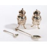 Pair of Edward VII silver pepperettes, London 1901, marks rubbed, each raised on three pad feet,