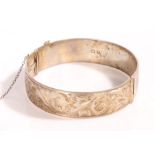 A sterling silver ornate bangle engraved 'Kathleen'. UK hallmarked. Diameter 2.5 inches.  Weighing