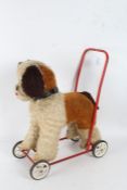 Stuffed push along toy dog on wheels