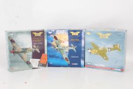 Three Corgi 'The Aviation Archive' models, Curtiss P-40E Warhawk, Supermarine Spitfire MkV, and