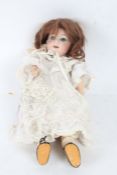 Gebruder Heubach bisque headed doll, numbered 8192, with blue eyes, 30cm long