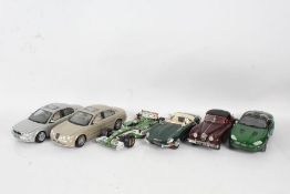 A Beanstalk Group Jaguar XKR 1/18 scale in green, Maisto Jaguar X-Type 1/18 scale in silver,