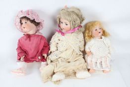 Three Armand Marseille bisque headed dolls, all with outfits, two stamped 995, and one 996, the
