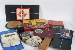 Collection of various board games, to include solitaire boards, Quintro, Scrabble, Monopoly, a bag